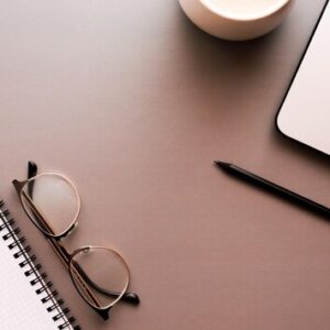 Flat lay workspace desktop | business education freelance banner | laptop, notebook and office accessories overhead